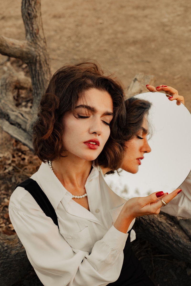 Woman Holding Mirror